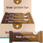 True Protein Choc Peanut Butter 12-pack display box, individual 63g bar, and loose peanuts on a white background.