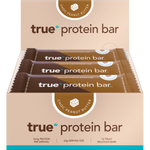 Display box of 12 True Protein Choc Peanut Butter bars (63g) with a white and orange label.