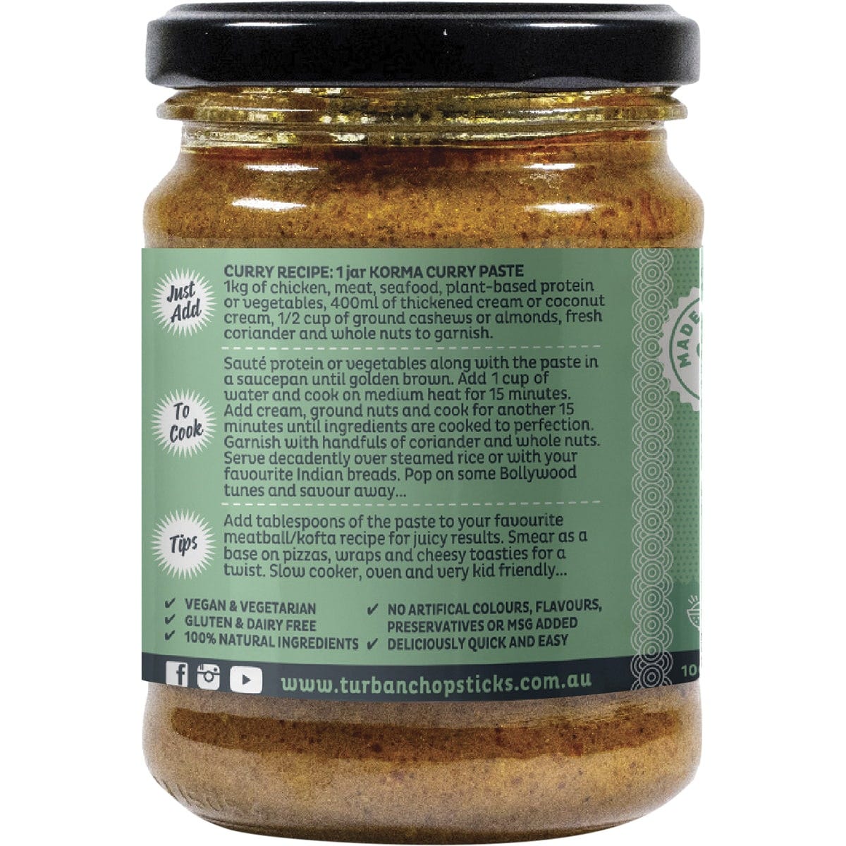 Side view of a Turban Chopsticks Korma Curry Paste jar with a yellow label and botanical illustrations.