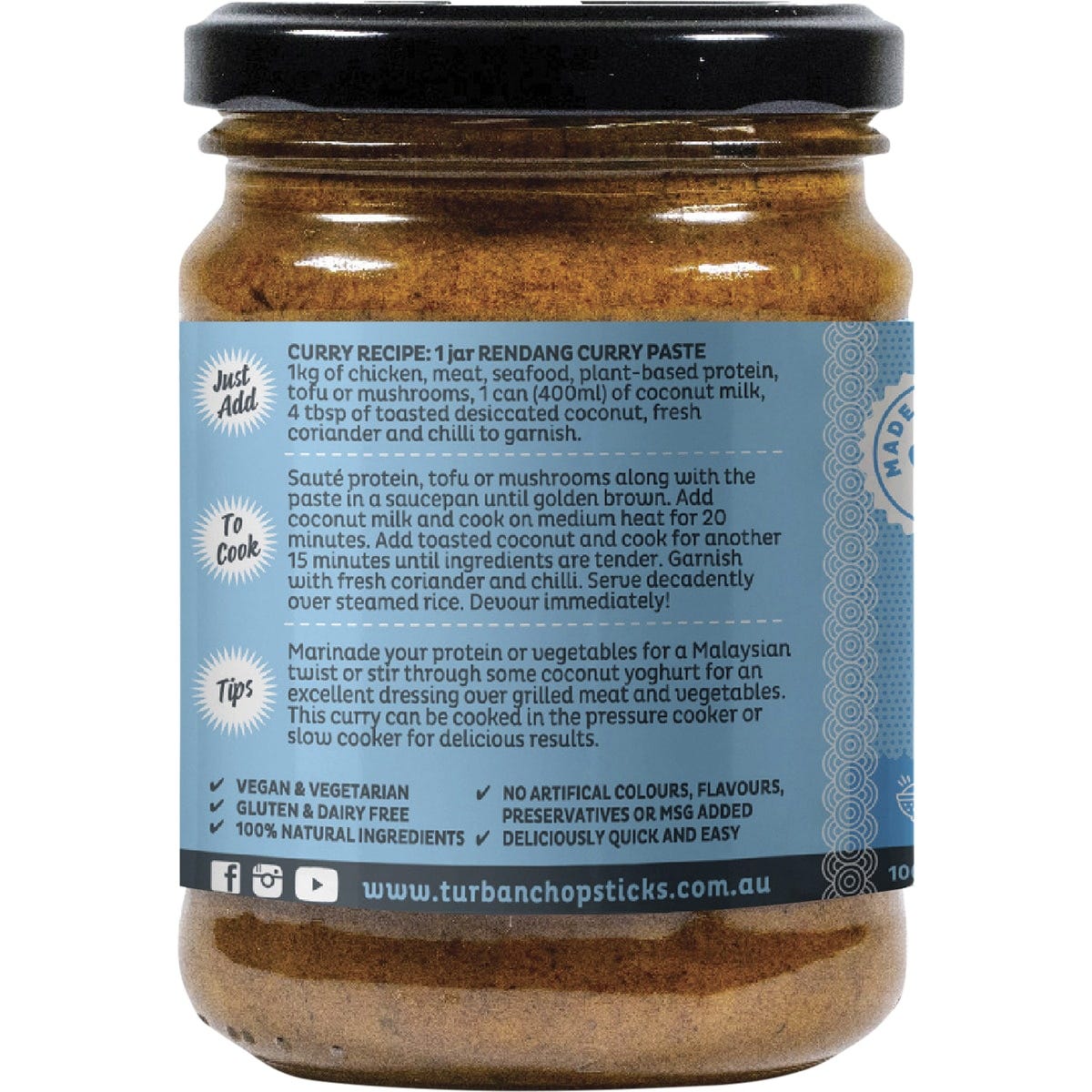 Side view of a Turban Chopsticks Rendang Curry Paste 240g jar featuring an orange label and recipe instructions.