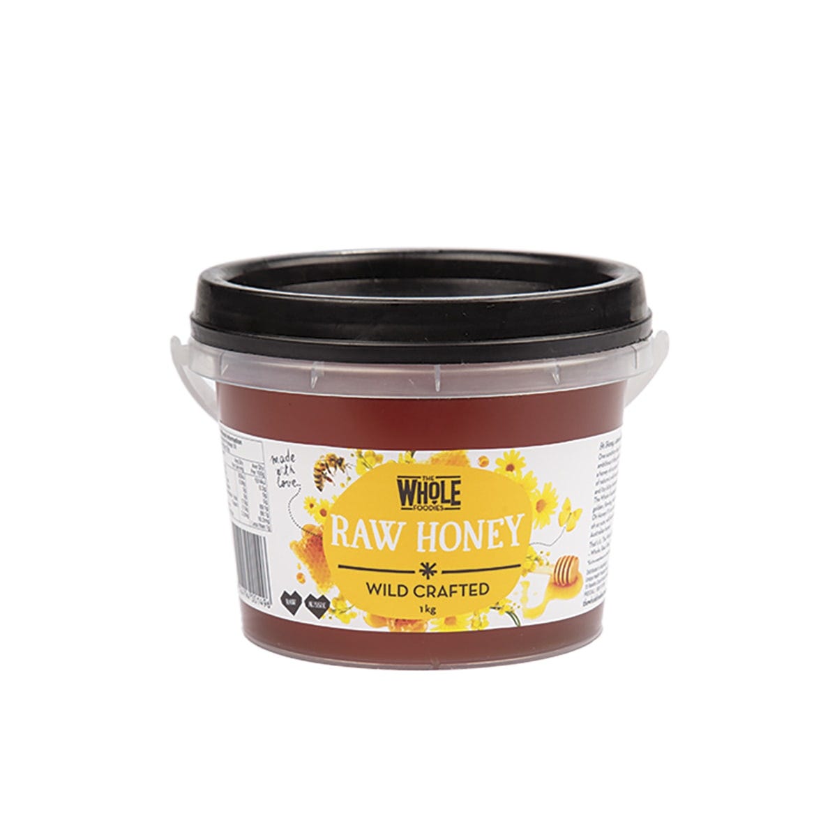 1kg tub of The Whole Foodies Raw Wild Crafted Australian Honey with a golden label and black lid.