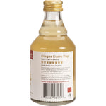 Side view of a 237ml bottle of Ginger People Ginger Juice highlighting usage tips and a barcode.