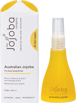 85ml bottle of Australian Jojoba Oil for face and body with a gold pump lid on a white background.