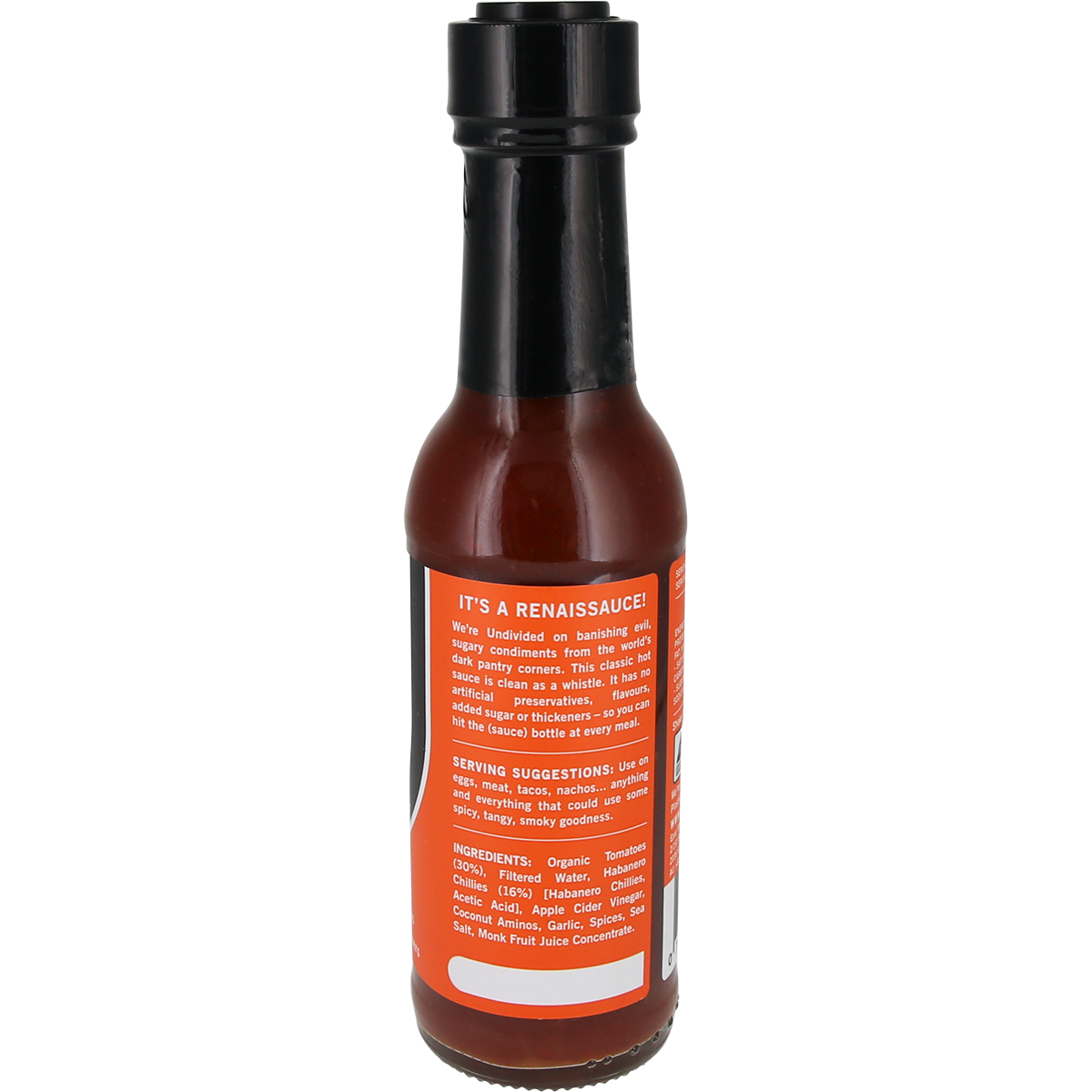 A bottle of hot sauce with a black cap and a bright orange label, photographed on a plain white background. The label contains white text and lists ingredients including tomato paste, vinegar, garlic, and black pepper.