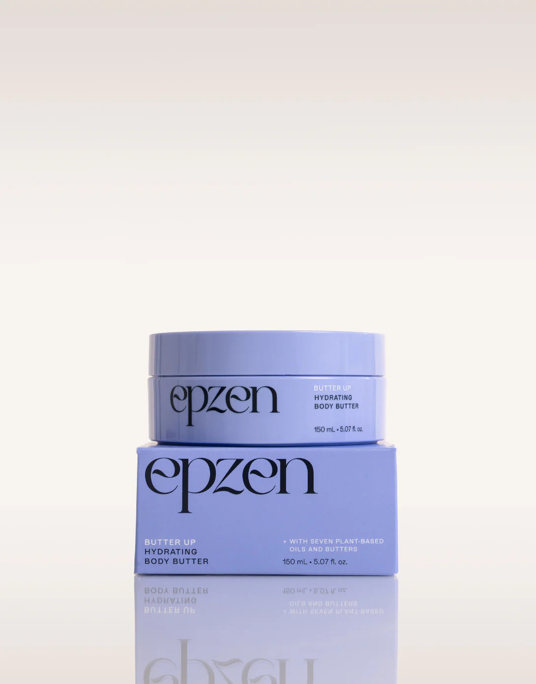 A person's hands holding a purple tub of Epzen Body Butter, showcasing its botanical illustrations and 150ml size.