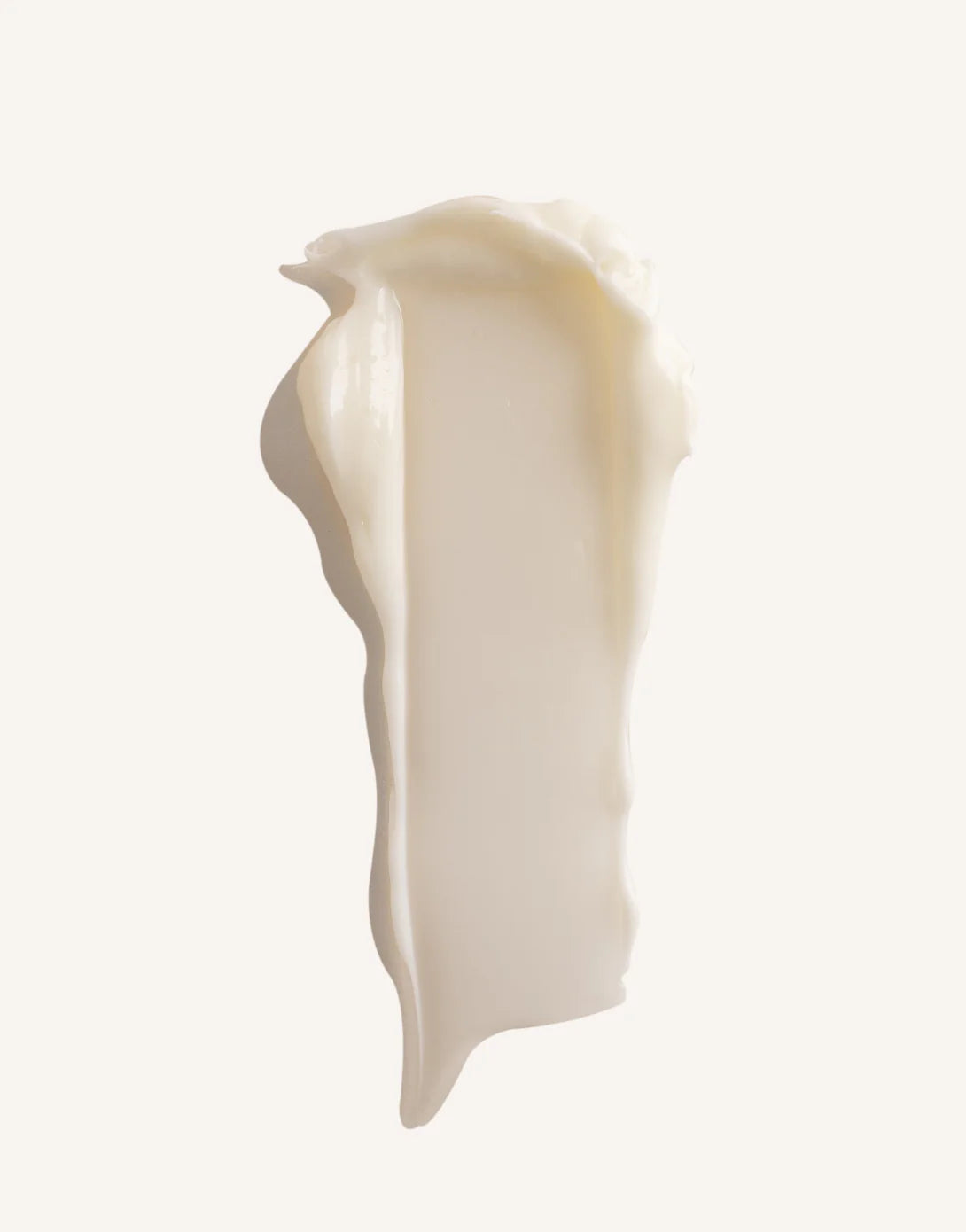Close-up of a person applying white Epzen body butter onto their arm from a purple 150ml tub.