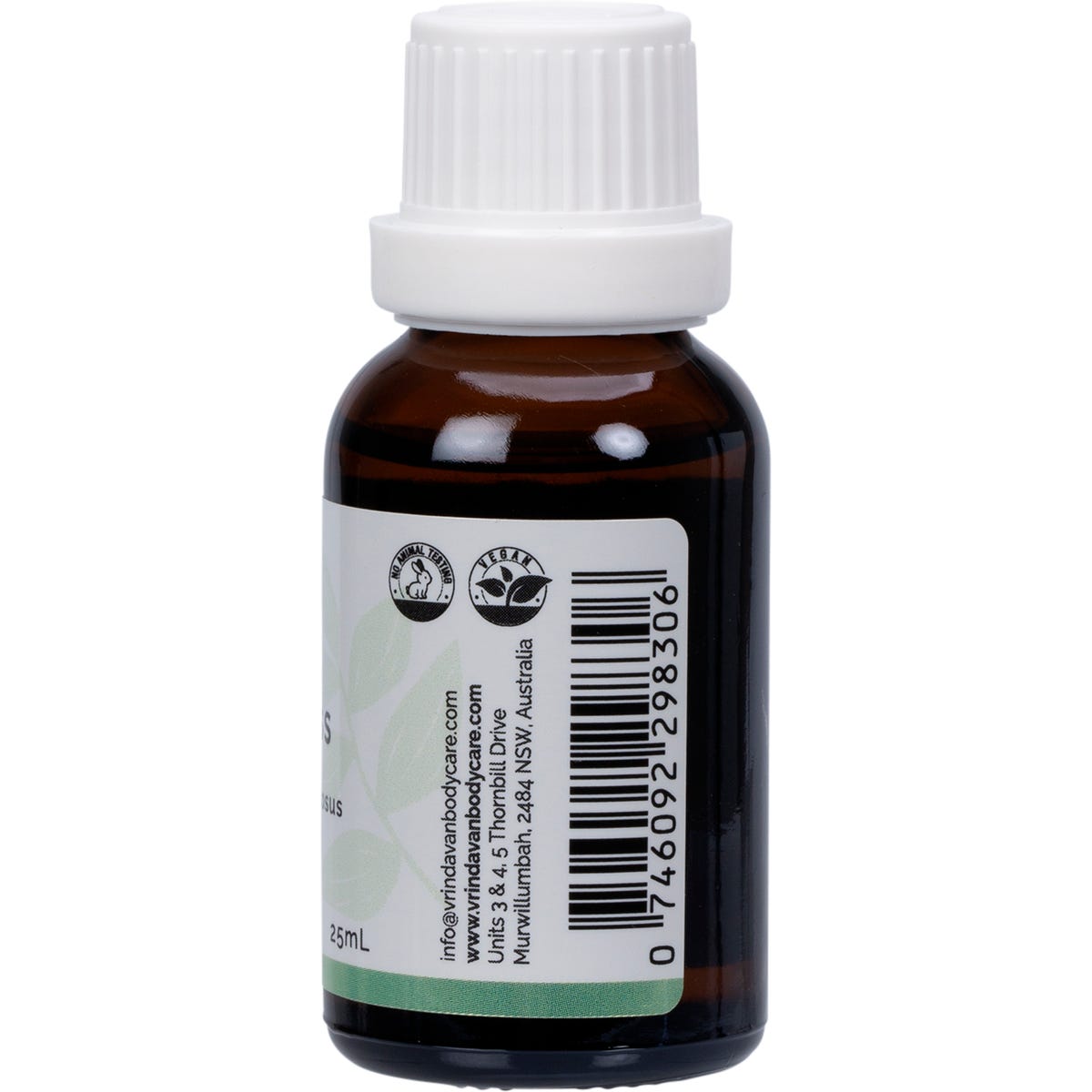 Right side of a Vrindavan Lemongrass Essential Oil bottle showing benefits, storage, and warning labels.