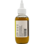 Right side of 100ml Vrindavan Batana Oil bottle showing ingredients and botanical design on a white background.