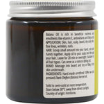 Left side of a 100ml glass jar of Vrindavan Raw Batana Oil showing usage instructions for hair and skin.