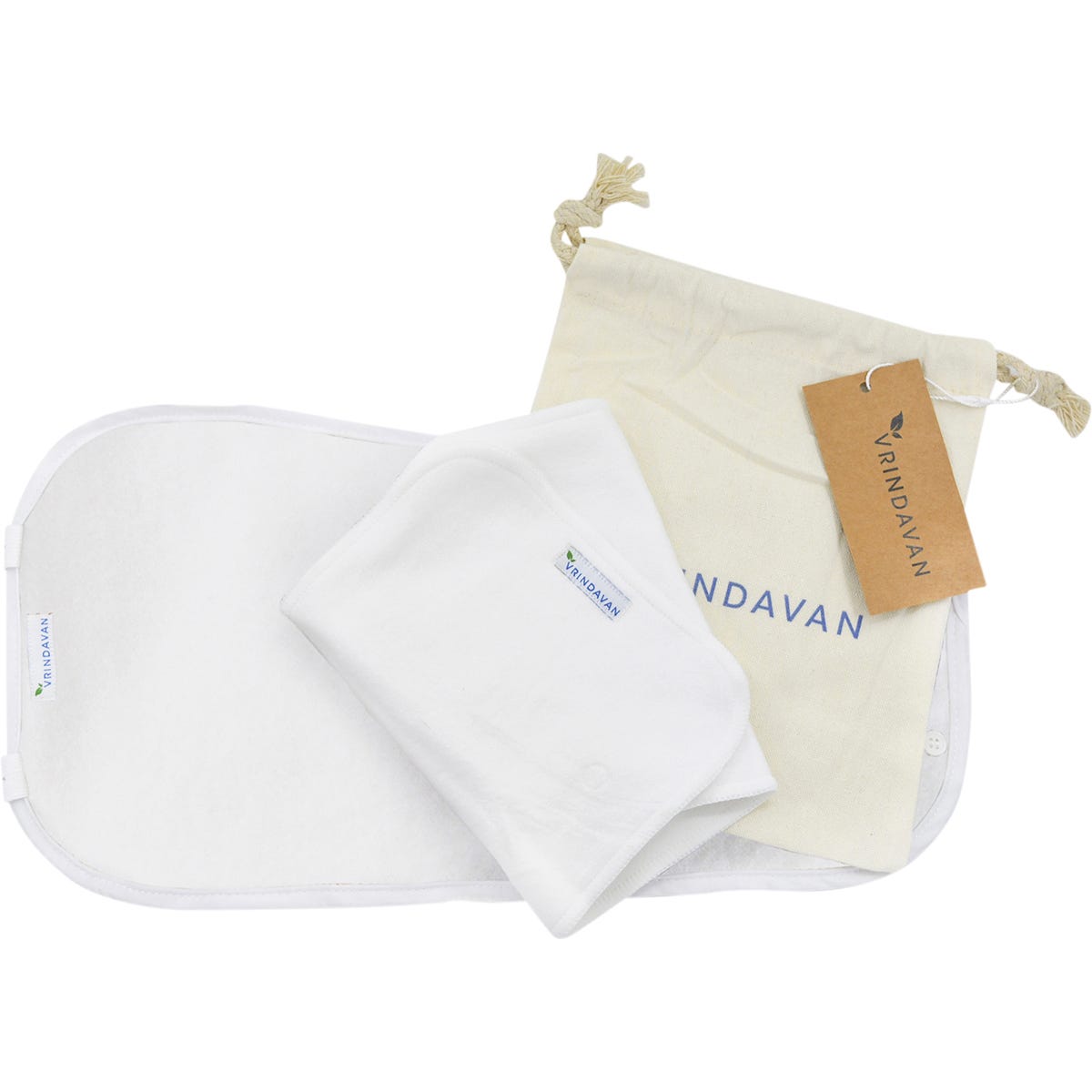 White Vrindavan Castor Oil Pack with an organic cotton insert and calico storage bag on a white background.