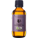 100ml amber glass bottle of Vrindavan 100% Natural Castor Oil with a black screw cap on a white background.