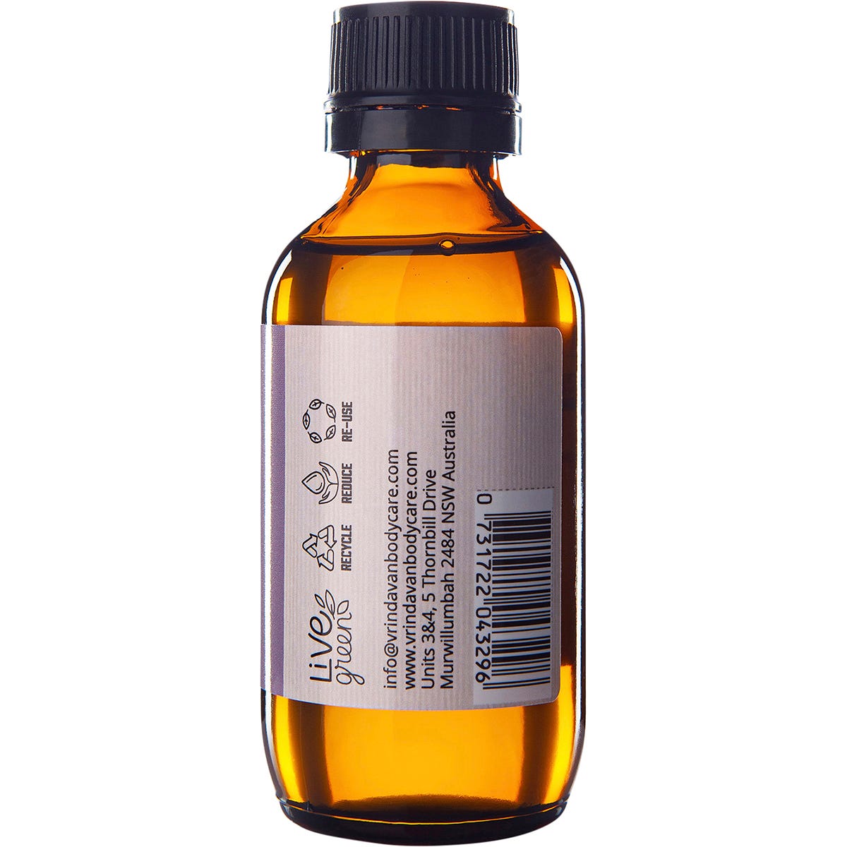 Right side of a 100ml amber glass bottle of Vrindavan Castor Oil showing nutrition and supplemental facts.