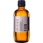 Right side of a 200ml Vrindavan Castor Oil glass bottle showing the barcode and a continuation of the botanical label.