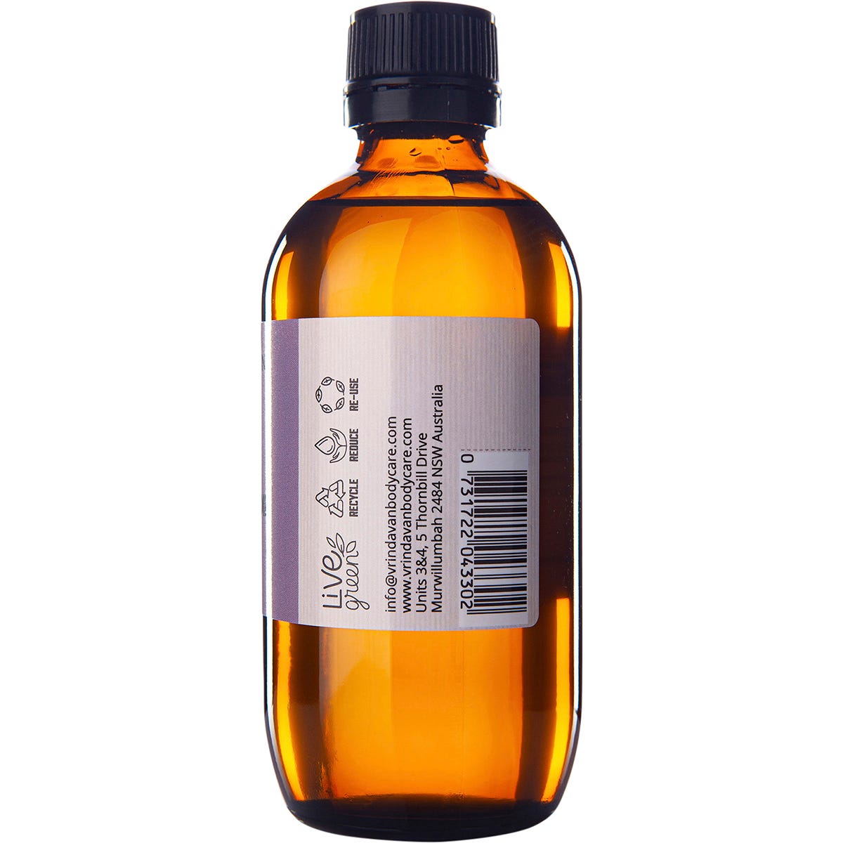 Right side of a 200ml Vrindavan Castor Oil glass bottle showing the barcode and a continuation of the botanical label.