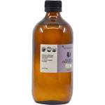 Left side of a 500ml Vrindavan Castor Oil amber glass bottle showing usage benefits and certified organic logo.