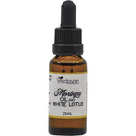 25ml glass bottle of Vrindavan Moringa Oil and White Lotus with a dropper lid and floral label.