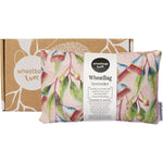 Wheatbag with a native Australian gum blossom floral print on a white background, next to its matching gift box.