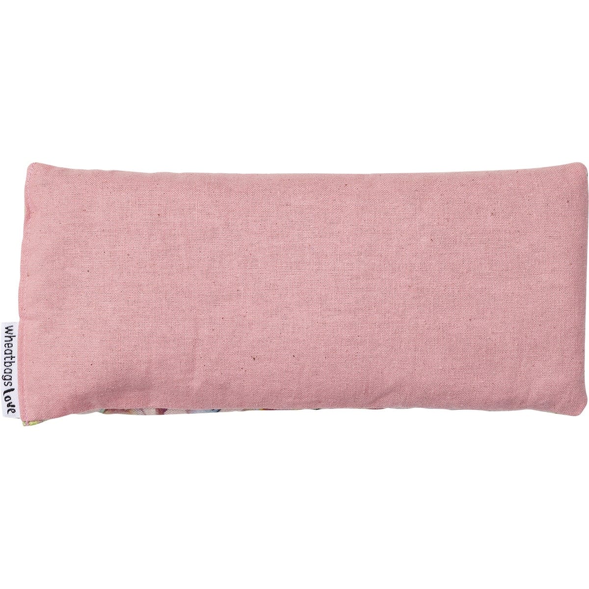 Pink cotton backing of a lavender-scented gum blossom eyepillow on a white background.