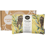 Lavender scented wheatbag with Banksia Pod floral print and tumeric back, shown with its matching gift box.