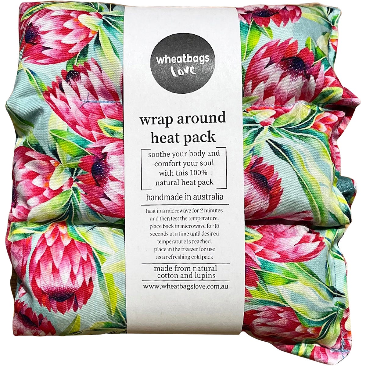 Wheatbags Love wrap-around heat pack in Protea floral print with adjustable cotton straps and a matching gift box.