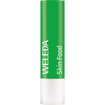 Weleda Skin Food Lip Balm stick with botanical illustrations of pansy and chamomile on a green and white tube.