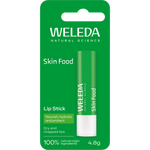 Green cardboard box for Weleda Skin Food Lip Balm featuring botanical illustrations of pansy and chamomile.
