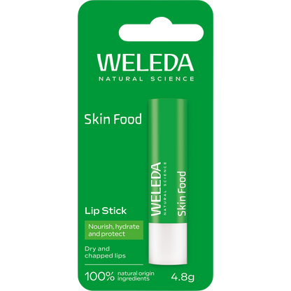 Green cardboard box for Weleda Skin Food Lip Balm featuring botanical illustrations of pansy and chamomile.
