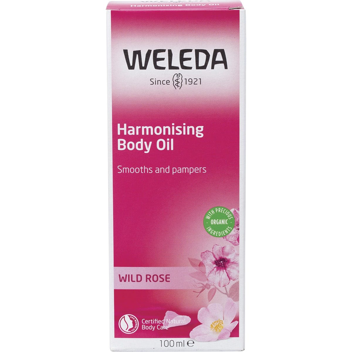Front of Weleda Wild Rose Harmonising Body Oil box featuring a pink label with rose illustrations on a white background.