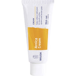 36ml tube of Weleda Arnica Cream for muscle aches and bruises, featuring yellow flowers on the label.