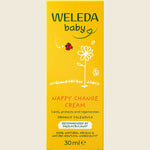 Weleda baby nappy change cream packaging on a beige background