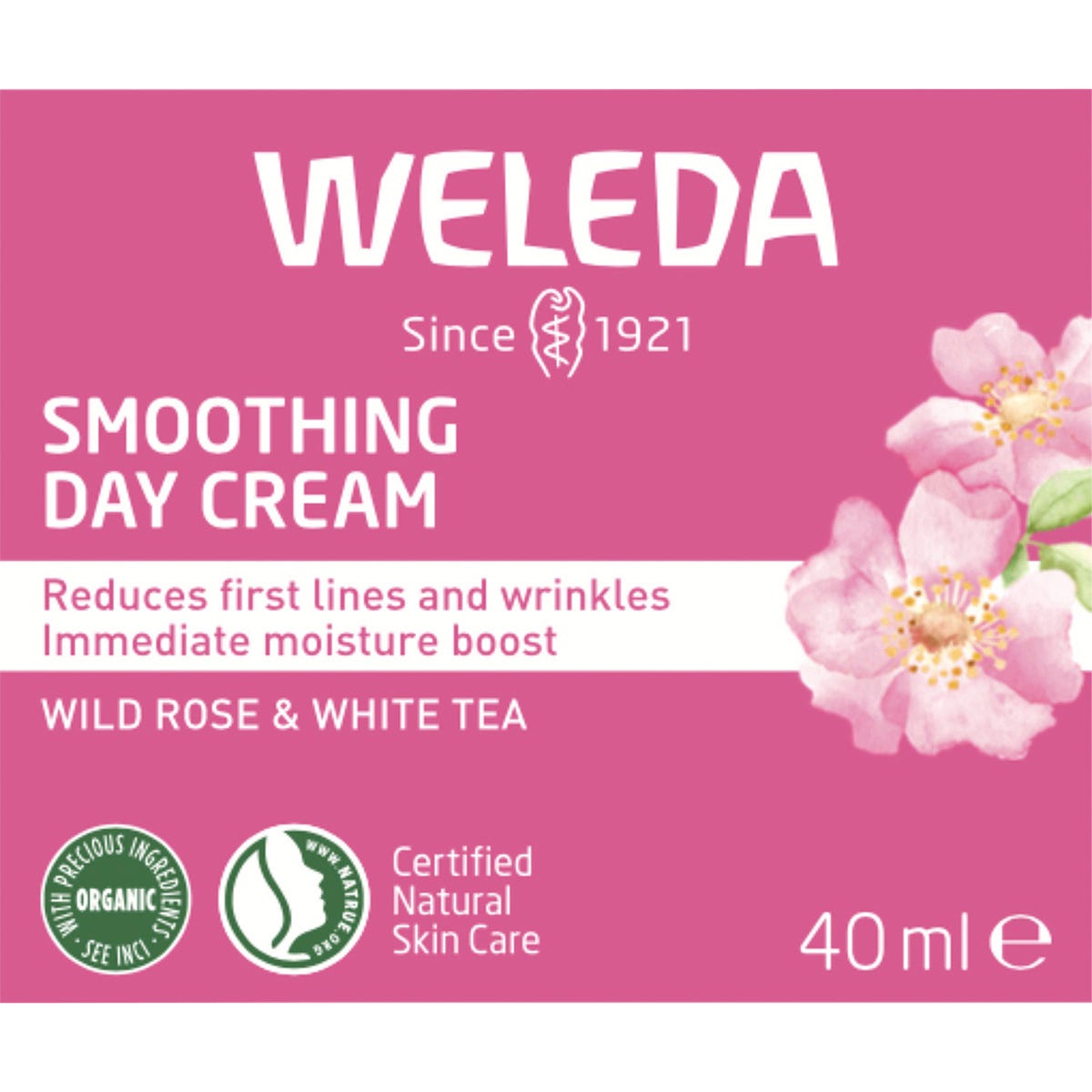 Front of Weleda Smoothing Day Cream box with wild rose and white tea illustrations on a white background.