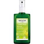 100ml glass bottle of Weleda Citrus Deo Spray with a yellow label and pump nozzle on a white background.