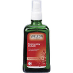 100ml glass bottle of Weleda Pomegranate Regenerating Body Oil with a red label and gold-colored cap.