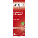 Front of a 50ml Weleda Regenerating Hand Cream Pomegranate box featuring a pomegranate illustration and organic logo.