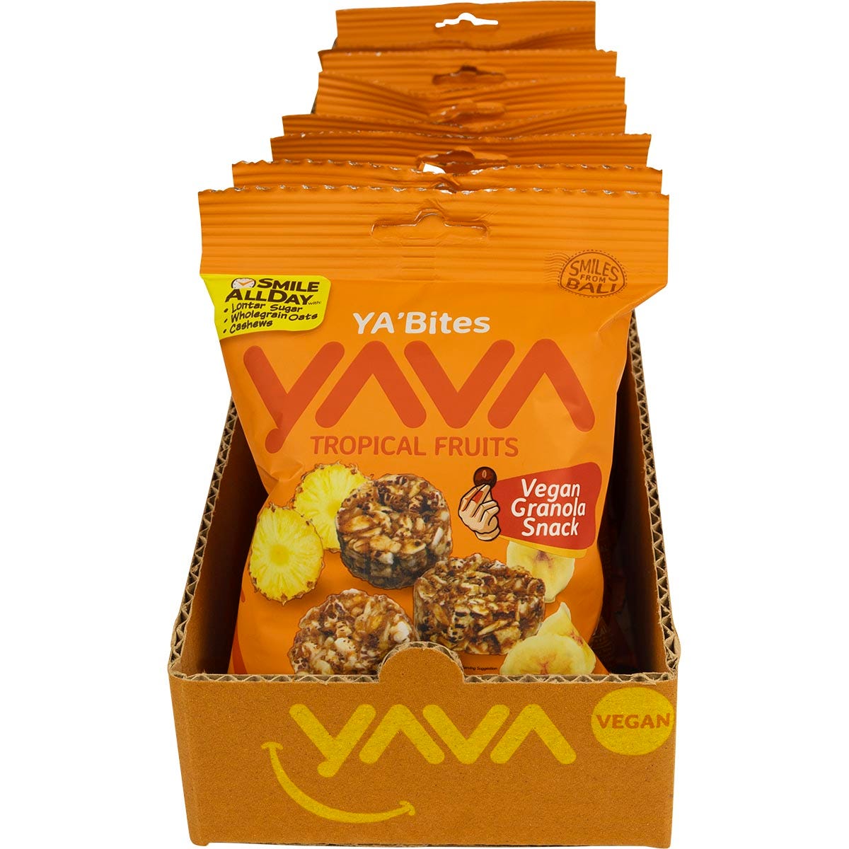 Retail display box of YAVA Tropical Fruits Granola Bites with individual 35g snack packs on a white background.