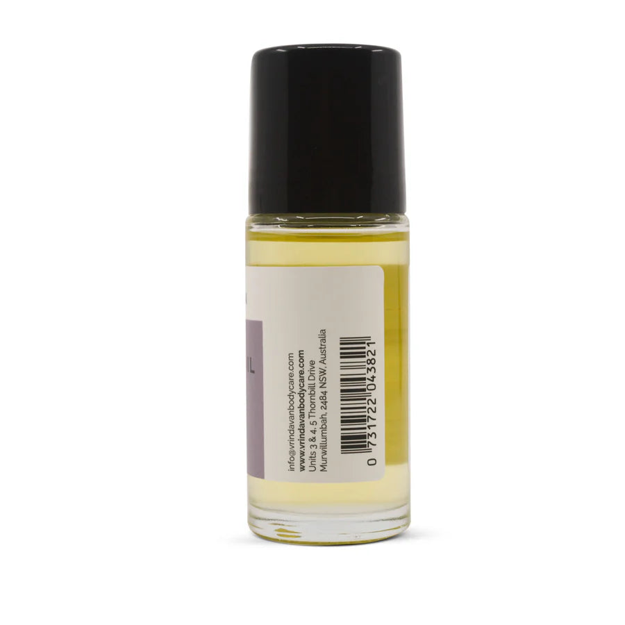 Vrindavan 50ml castor oil roll-on glass bottle with a white cap shown at a slight angle on a white background.