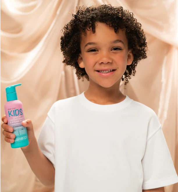 Giovanni Kids Leave-In Conditioning Elixir bottle with watermelon and strawberry illustrations on a white background.