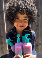 Giovanni Eco Chic Kids hair care collection featuring bottles with watermelon and strawberry illustrations.