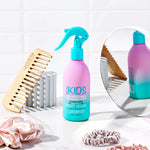 Kids Hair Smoothing and Detangling Spray 236ml bottle featuring watermelon and strawberry illustrations.