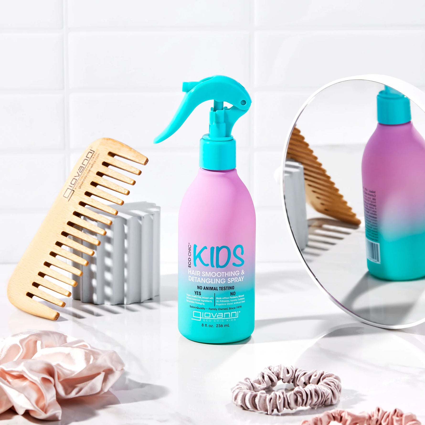 Kids Hair Smoothing and Detangling Spray 236ml bottle featuring watermelon and strawberry illustrations.